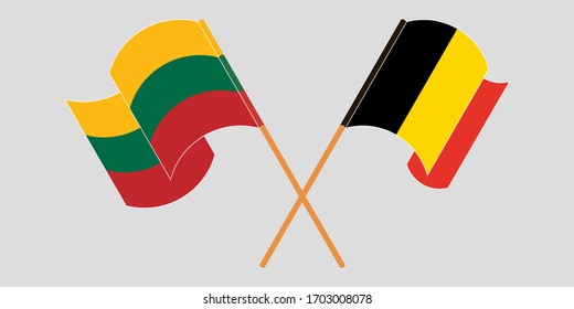 Crossed and waving flags of Lithuania and Belgium