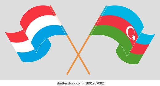 Crossed and waving flags of Luxembourg and Azerbaijan