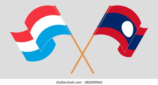 Crossed and waving flags of Luxembourg and Laos