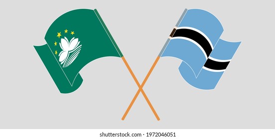 Crossed and waving flags of Macau and Botswana