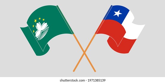 Crossed and waving flags of Macau and Chile