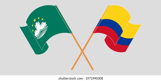 Crossed and waving flags of Macau and Colombia