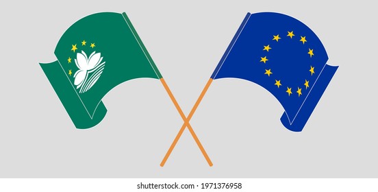 Crossed and waving flags of Macau and the European Union