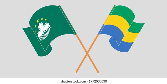 Crossed and waving flags of Macau and the Gambia