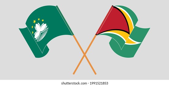 Banderas cruzadas y ondeando banderas de Macao y Guyana