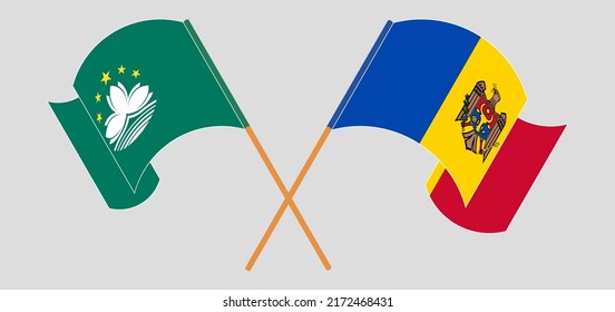 Crossed and waving flags of Macau and Moldova. Vector illustration

