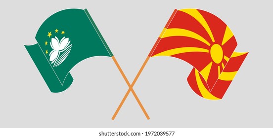 Crossed and waving flags of Macau and North Macedonia