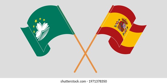 Crossed and waving flags of Macau and Spain