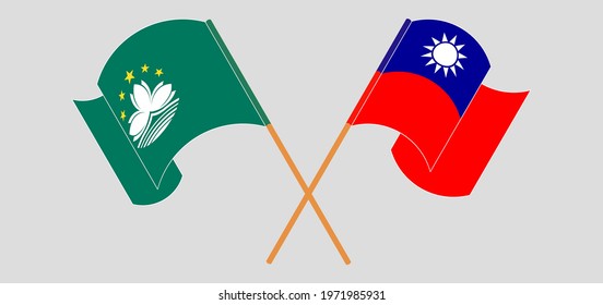Crossed and waving flags of Macau and Taiwan