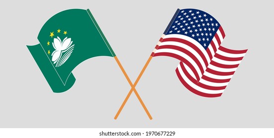 Crossed and waving flags of Macau and the USA