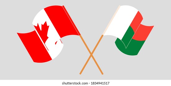 Crossed and waving flags of Madagascar and Canada. Vector illustration
