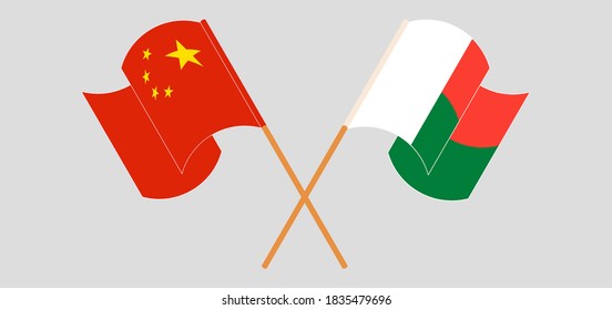 Crossed and waving flags of Madagascar and China. Vector illustration
