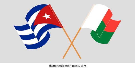 Crossed and waving flags of Madagascar and Cuba. Vector illustration
