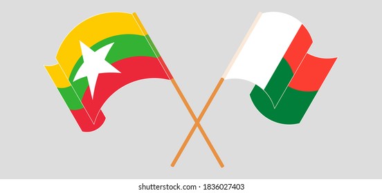 Crossed and waving flags of Madagascar and Myanmar. Vector illustration
