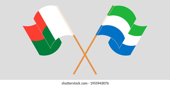 Gekreuzte und wehende Flaggen von Madagaskar und Sierra Leone