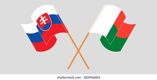 Crossed and waving flags of Madagascar and Slovakia. Vector illustration
