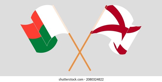 Crossed and waving flags of Madagascar and The State of Alabama. Vector illustration
