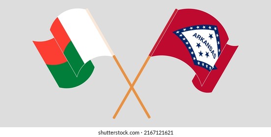 Überquerte und wehende Flaggen von Madagaskar und dem Bundesstaat Arkansas. Vektorgrafik
