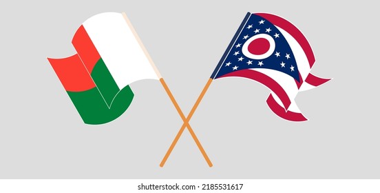Crossed and waving flags of Madagascar and the State of Ohio. Vector illustration
