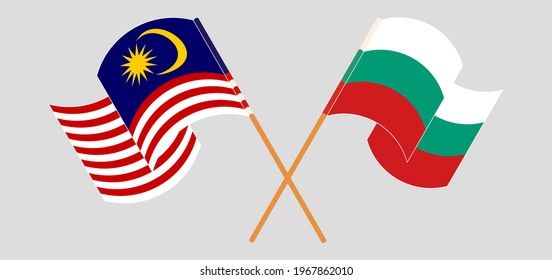 Crossed and waving flags of Malaysia and Bulgaria