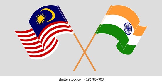 Crossed and waving flags of Malaysia and India