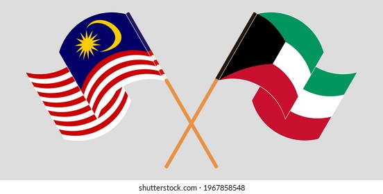 Crossed and waving flags of Malaysia and Kuwait