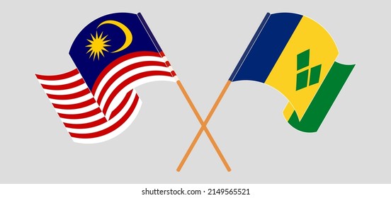 Crossed and waving flags of Malaysia and Saint Vincent and the Grenadines. Vector illustration
