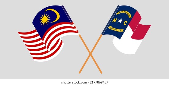 Crossed and waving flags of Malaysia and The State of North Carolina. Vector illustration
