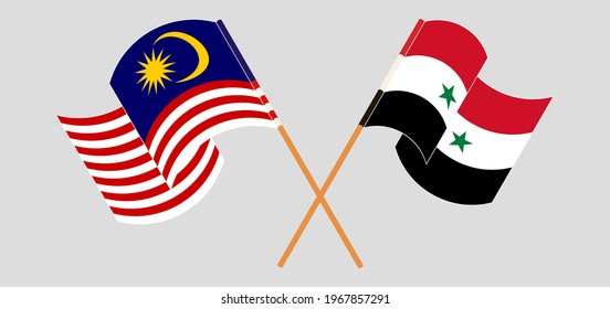 Crossed and waving flags of Malaysia and Syria