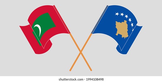 Crossed and waving flags of Maldives and Kosovo