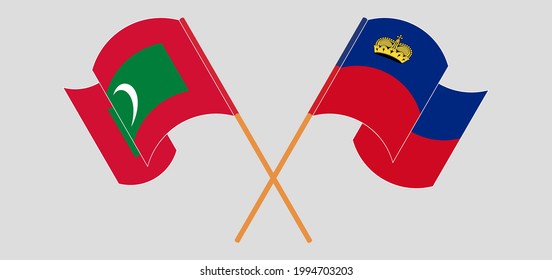 Crossed and waving flags of Maldives and Liechtenstein
