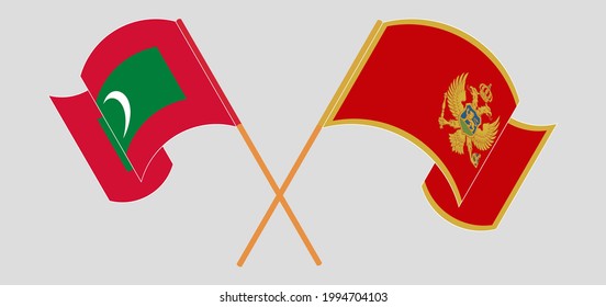 Crossed and waving flags of Maldives and Montenegro