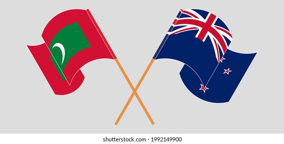 Crossed and waving flags of Maldives and New Zealand