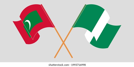 Crossed and waving flags of Maldives and Nigeria