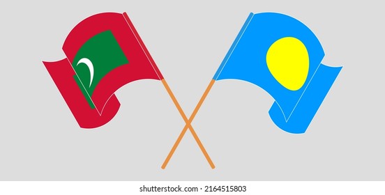 Crossed and waving flags of Maldives and Palau. Vector illustration
