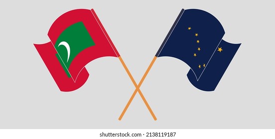 Crossed and waving flags of Maldives and the State of Alaska. Vector illustration
