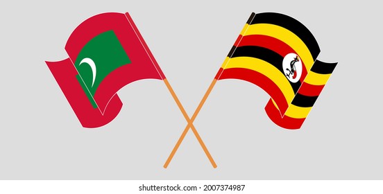 Gekreuzte und wehende Flaggen der Malediven und Uganda