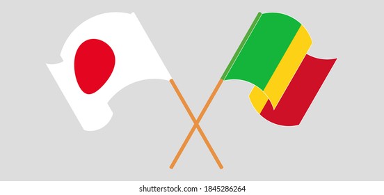 Crossed and waving flags of Mali and Japan