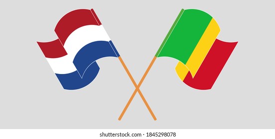 Crossed and waving flags of Mali and the Netherlands
