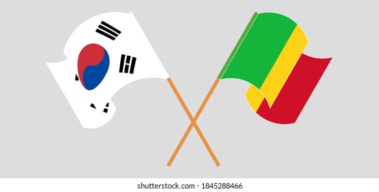 Crossed and waving flags of Mali and South Korea