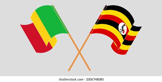 Crossed and waving flags of Mali and Uganda