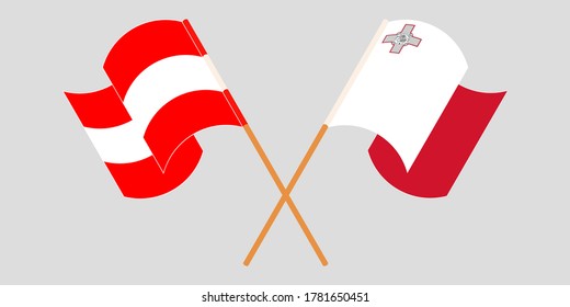 Crossed and waving flags of Malta and Austria