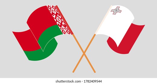 Banderas cruzadas y ondeando banderas de Malta y Belarús