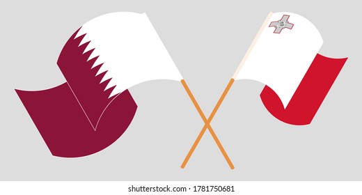 Crossed and waving flags of Malta and Qatar