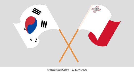 Crossed and waving flags of Malta and South Korea