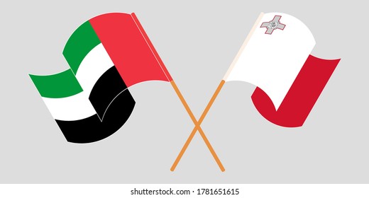 Crossed and waving flags of Malta and United Arab Emirates