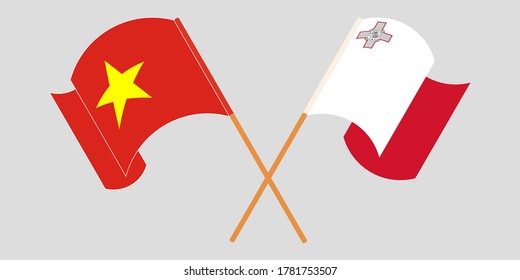 Crossed and waving flags of Malta and Vietnam