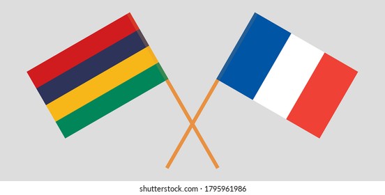 Crossed and waving flags of Mauritius and France