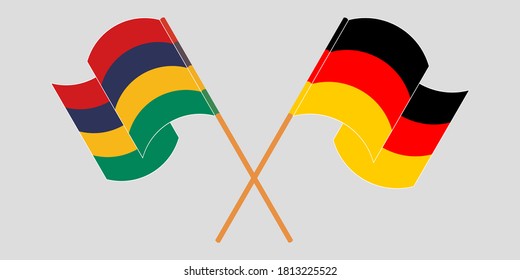 Crossed and waving flags of Mauritius and Germany