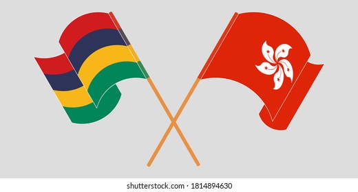 Banderas cruzadas y ondeando banderas de Mauricio y Hong Kong